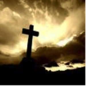 Cross silhouetted against an evening sky
